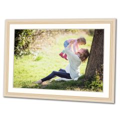 Picture framing featuring a photo of a mother and child playing