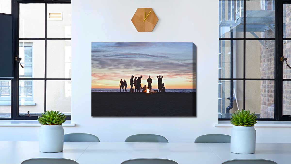 Photo of cooking on a beach campfire, printed on canvas and hung in a dining room