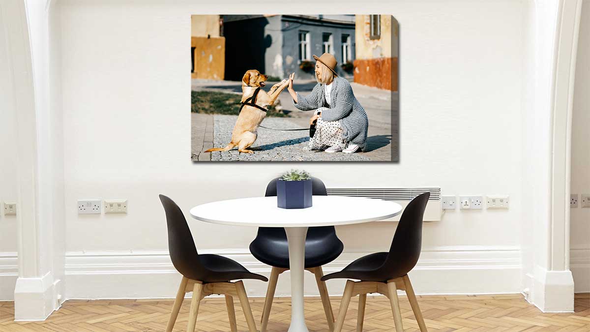 Canvas print featuring a pet dog doing a high-five withs its owner