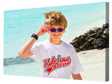 Quirky image of young lad on the beach printed on canvas